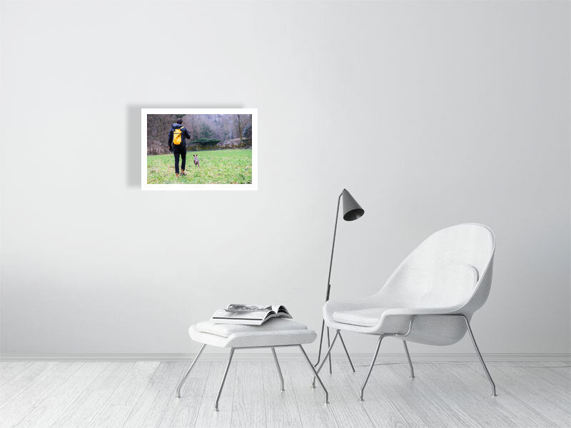 Rest days, displayed in a white minimalist room, chair, stool with a magazine on it, a side light. 