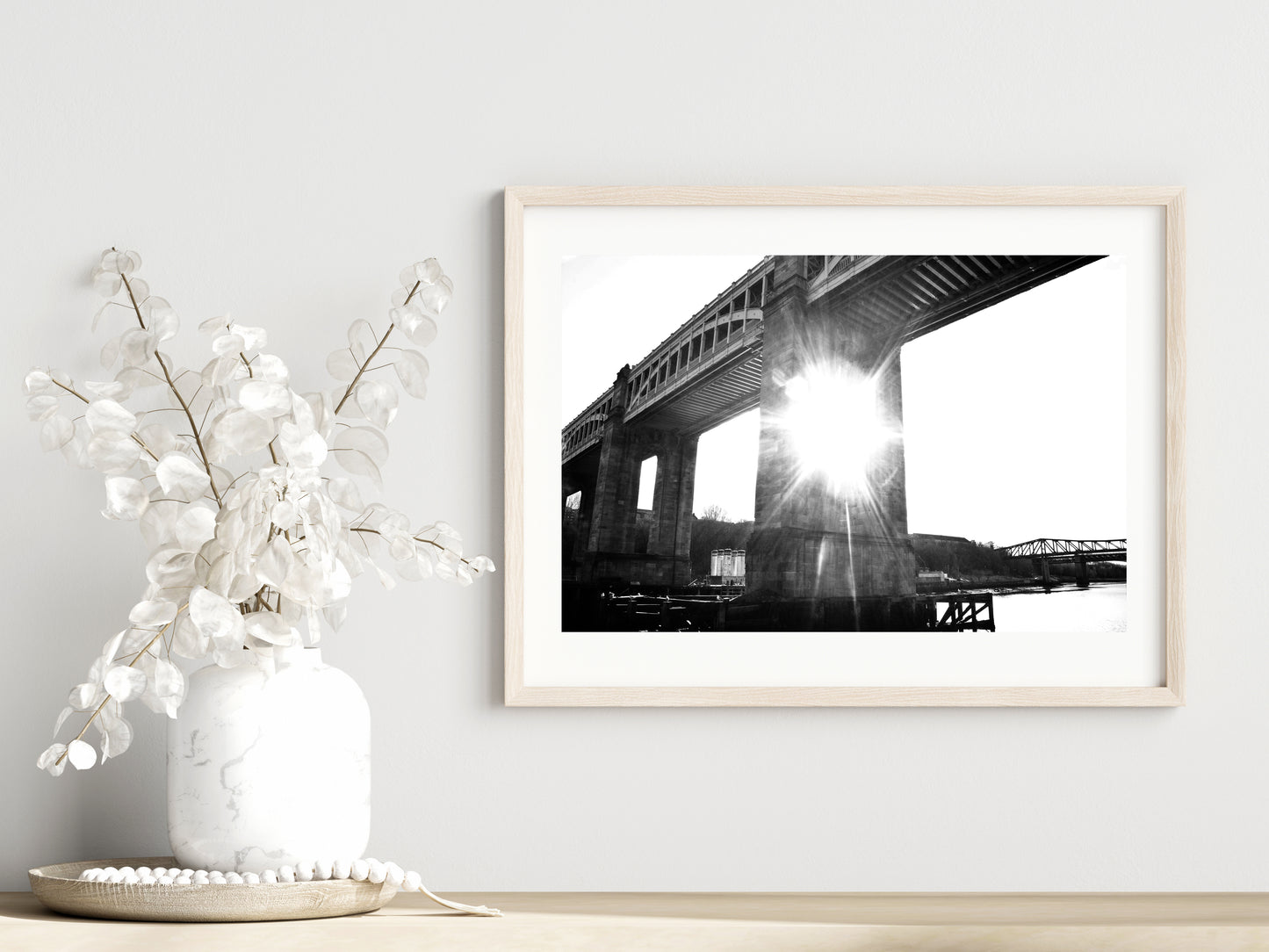 High bridge print showcased in a template for a room setting with minimalist plants, as it would be if purchased displayed